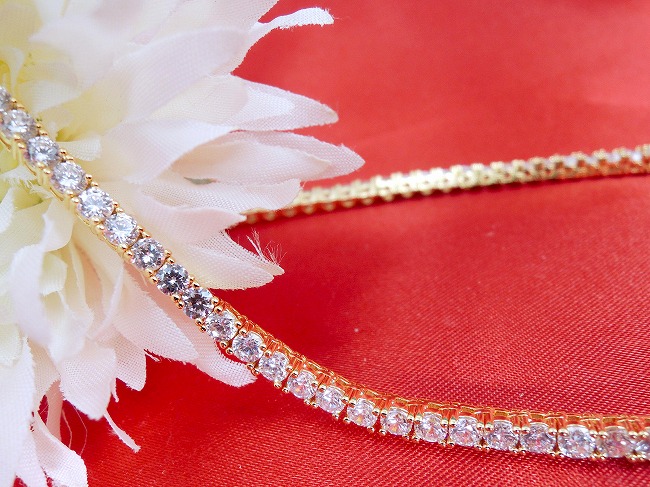 �S�[���h�e�j�X�l�b�N���X�@�L���[�r�b�N�W���R�j�A�E�A�N�Z�T���[