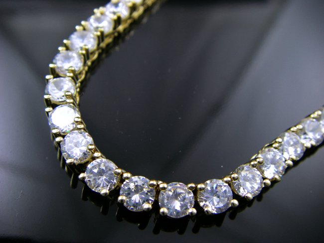 �S�[���h�e�j�X�l�b�N���X�@�L���[�r�b�N�W���R�j�A�E�A�N�Z�T���[